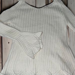White top, has bows you can tie at the shoulders, flare bottom and sleeves.
